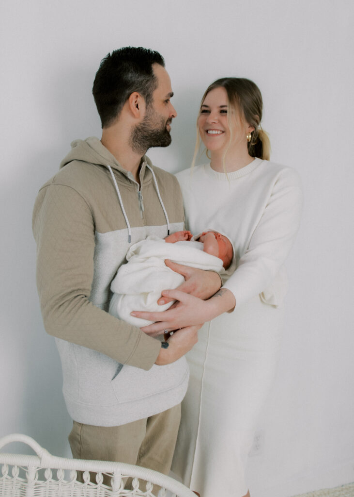 parents holding newborn, utah photographer