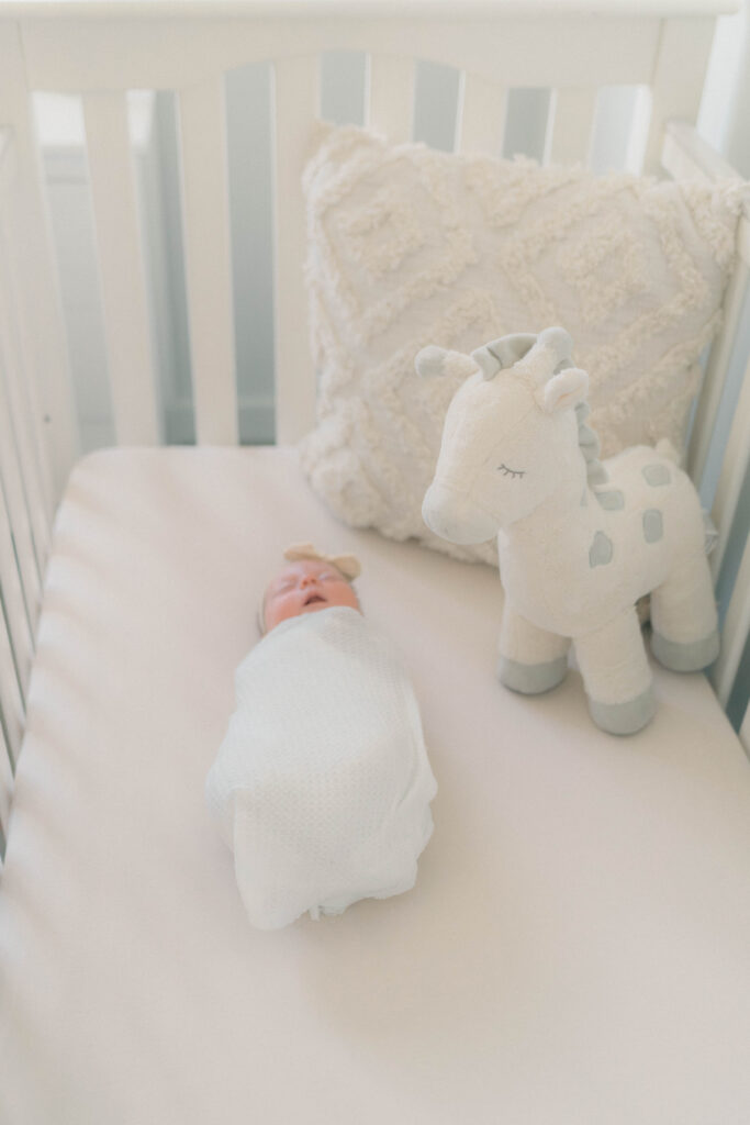 Newborn in the crib in Salt Lake City utah by Salt Lake City newborn photographer