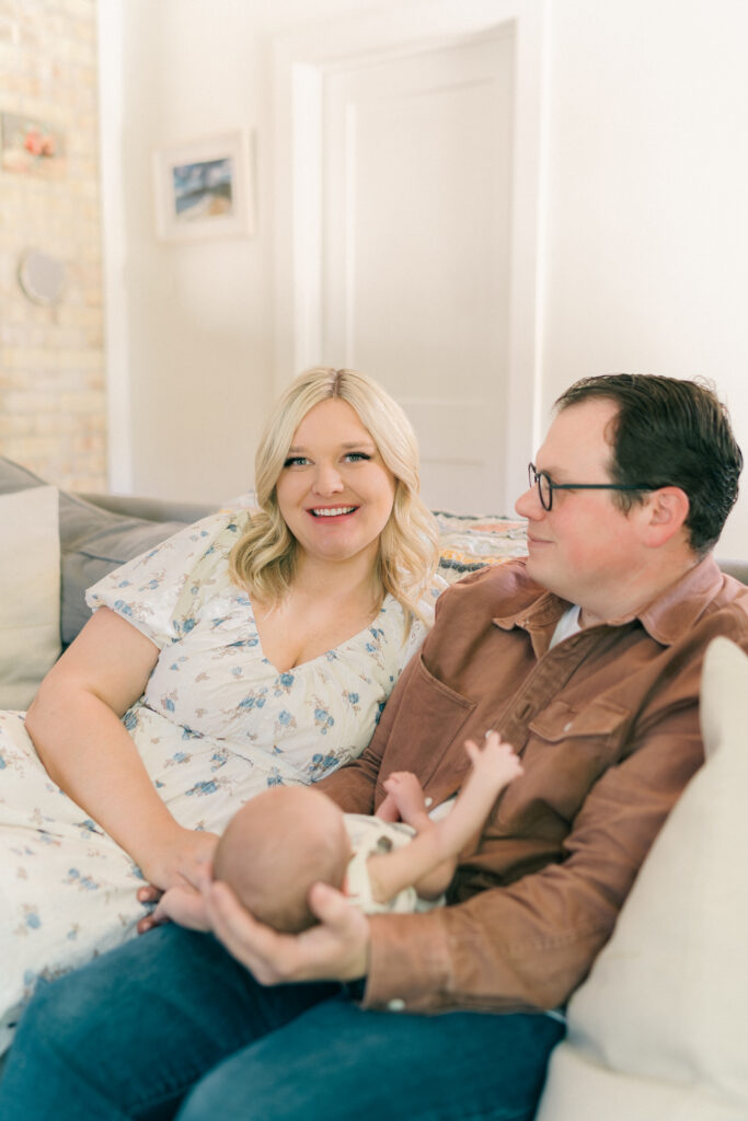 Cozy in-home newborn session in Holladay, Utah with baby snuggled in the nursery. Captured by Iris Graciela Photography.