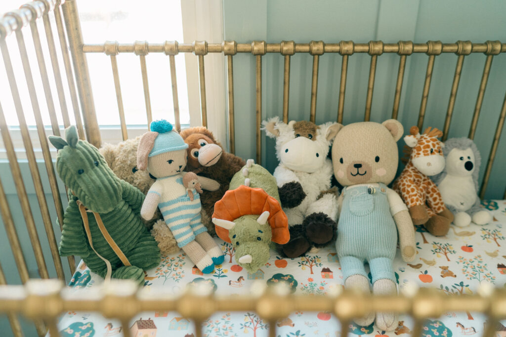 Baby resting peacefully in crib during Salt Lake City in-home newborn session.